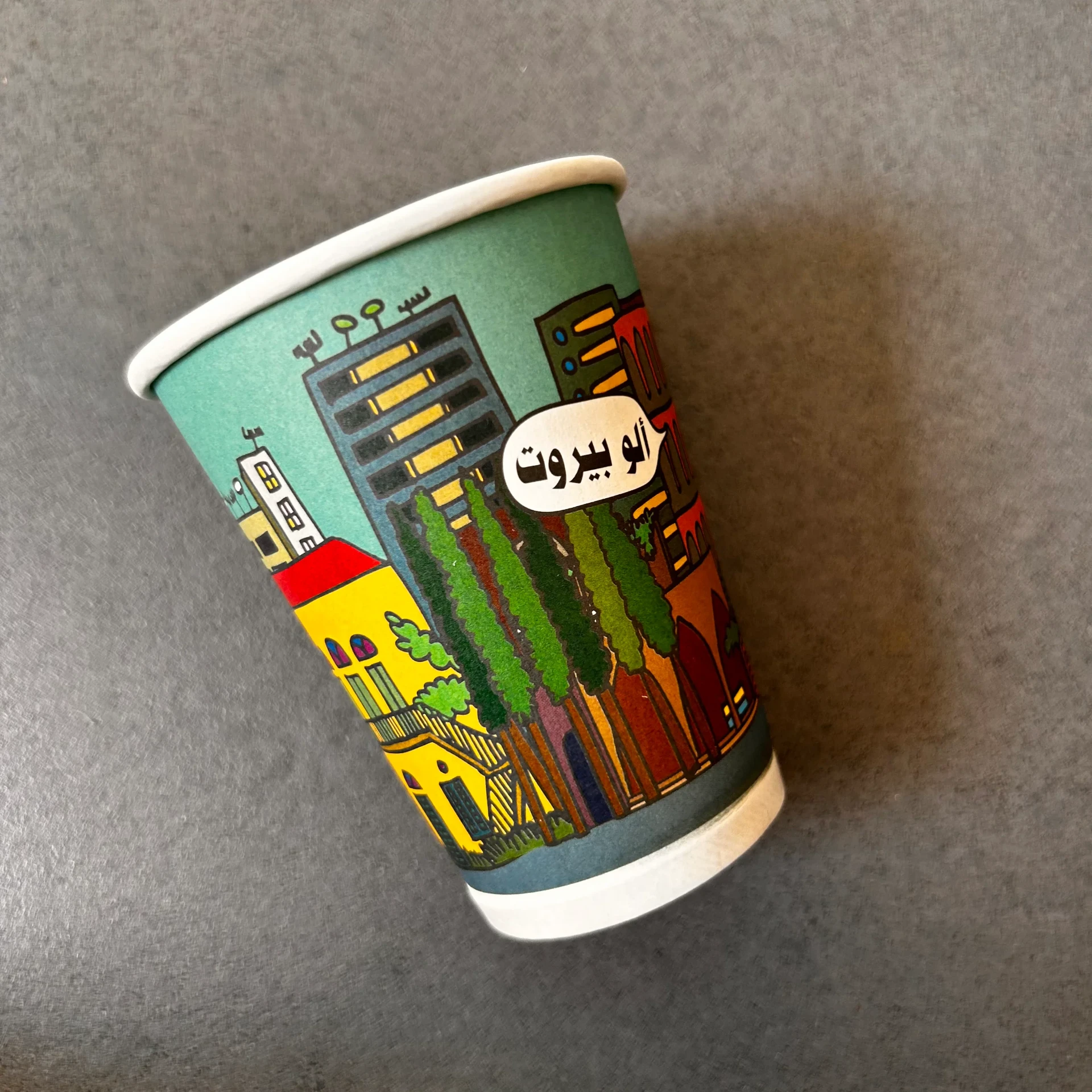 Illustrated Beirut coffee cup resting on a table